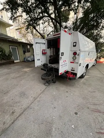 Magnet Plumbing service vehicle on-site for Grease Trap Cleaning in Californian